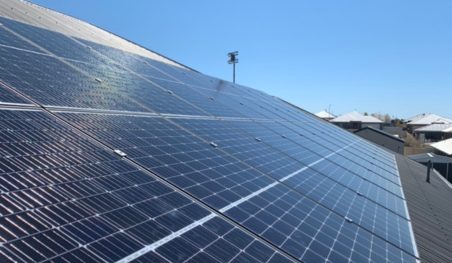 Solar panels installed on a roof under a clear sky