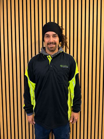 A Thomas Electrical and Solar team member in uniform
