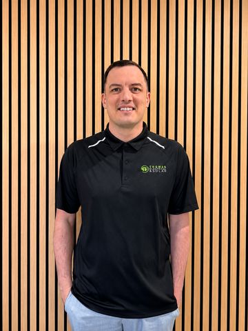 A Thomas Electrical and Solar team member in uniform
